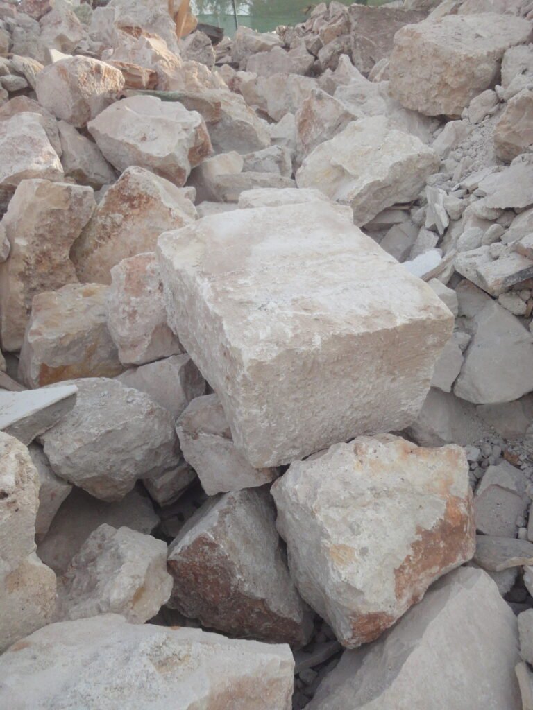 Smooth stones arranged at a thermal spa, representing restorative wellness travel